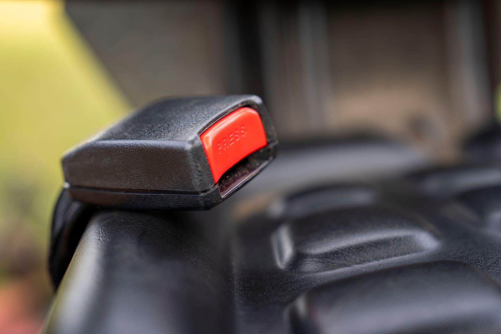 A car seat photographed in detail inside a vehicle